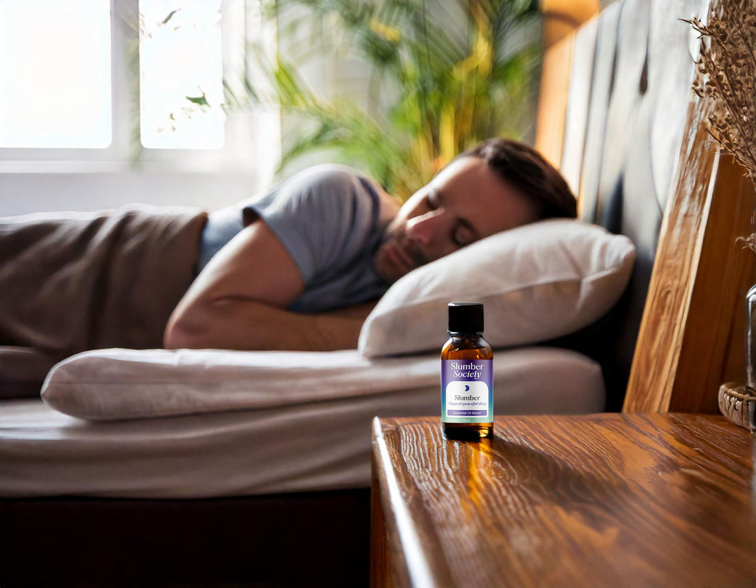 Man Sleeping peacefully with a bottle of Slumber Society Slumber Essential Oil on her bedside