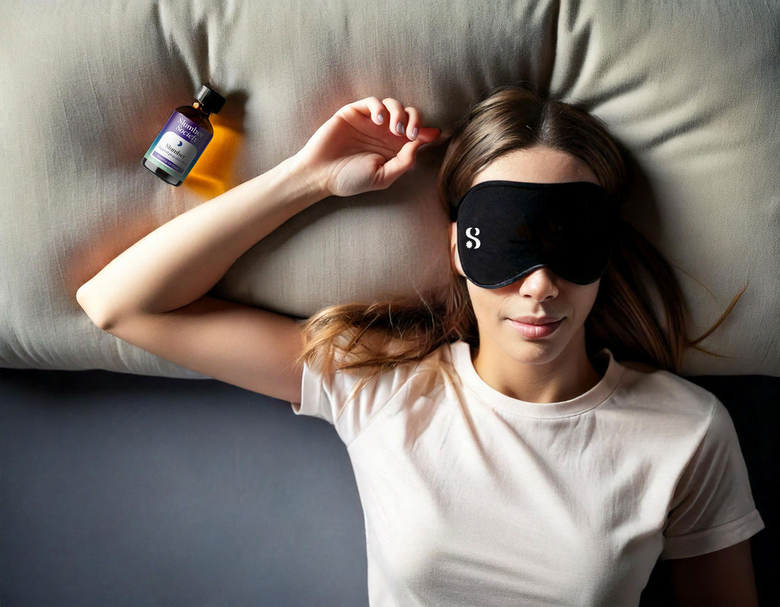 Female sleeping on pillow with Slumber Society Contoured Eye Mask and Slumber Essential Oil