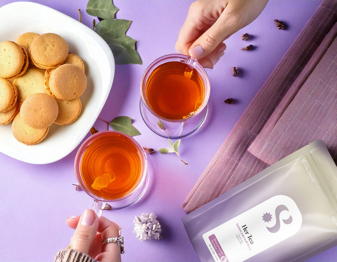 Slumber Spciety Herbal Tea being enjoyed by 2 people with some macarons on a plate