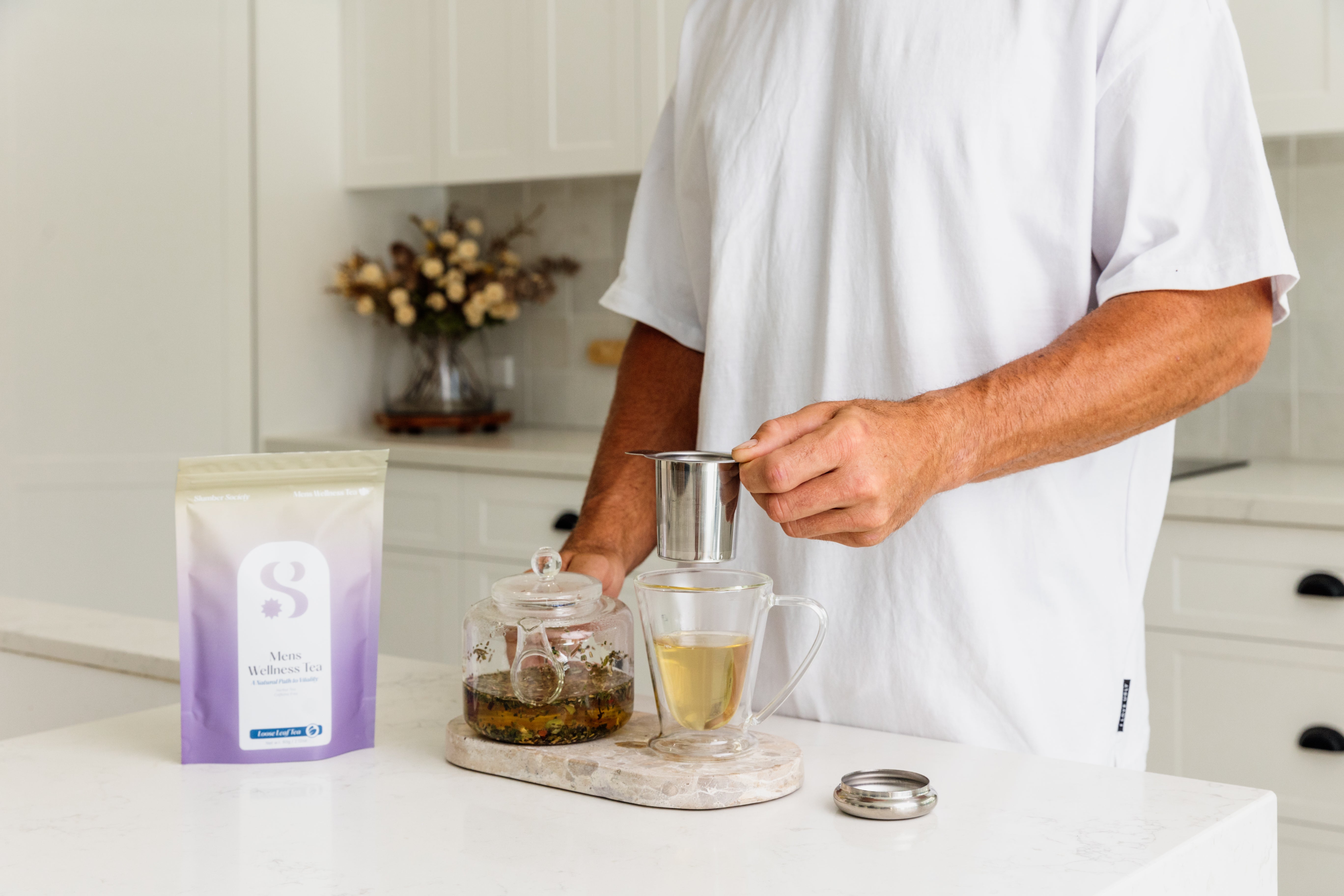 Male model making mens wellness loose leaf tea