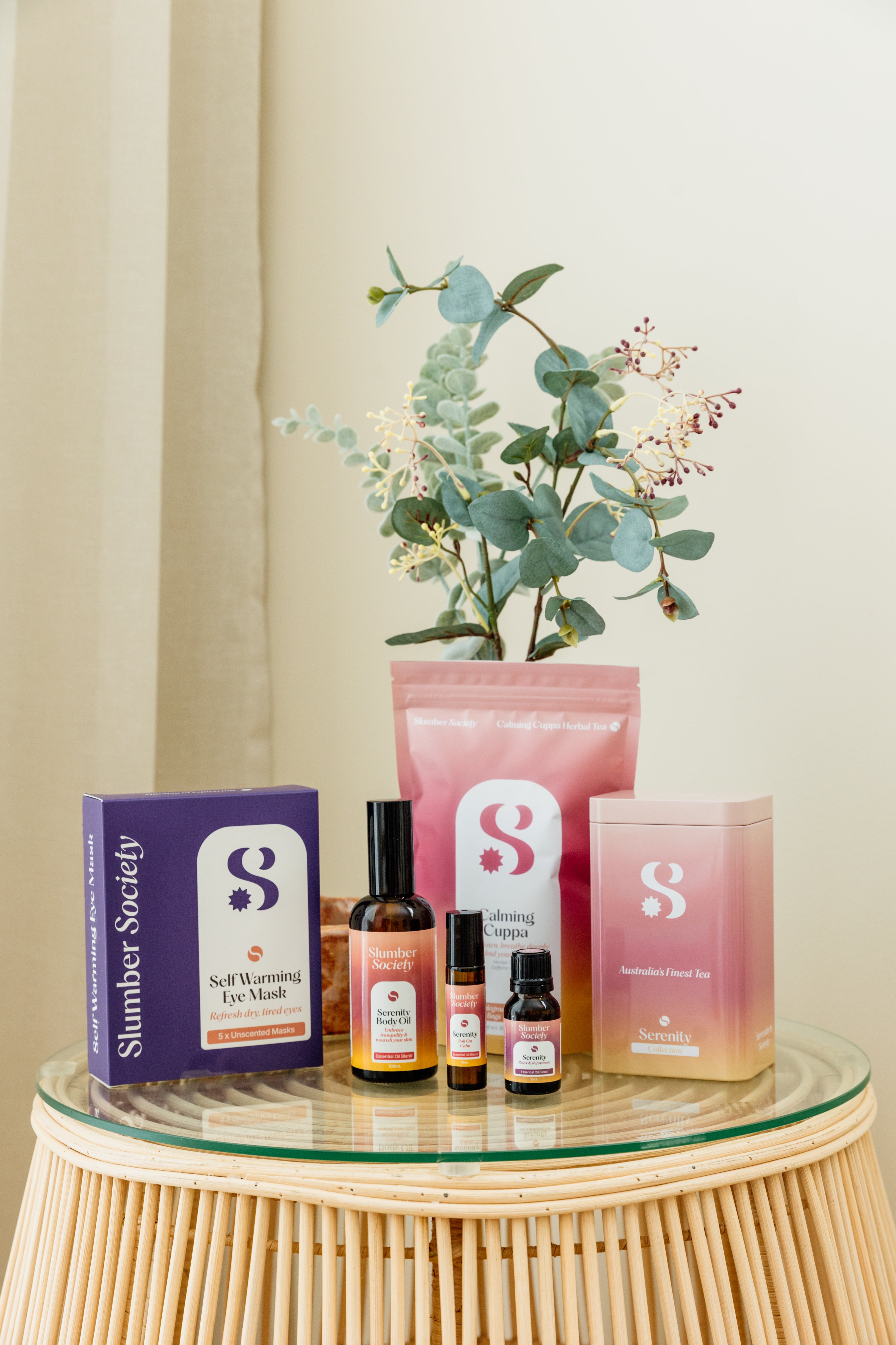 Slumber Society Serenity Bundle featuring Herbal tea, self warming eye masks, body oil, roll on, essential oil and tea tin.