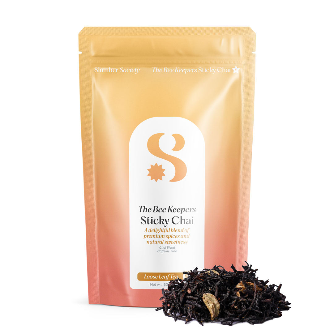 Slumber Society Bee Keeper Sticky Chai Loose Leaf Pouch with loose leaf chai placed in front of the pouch